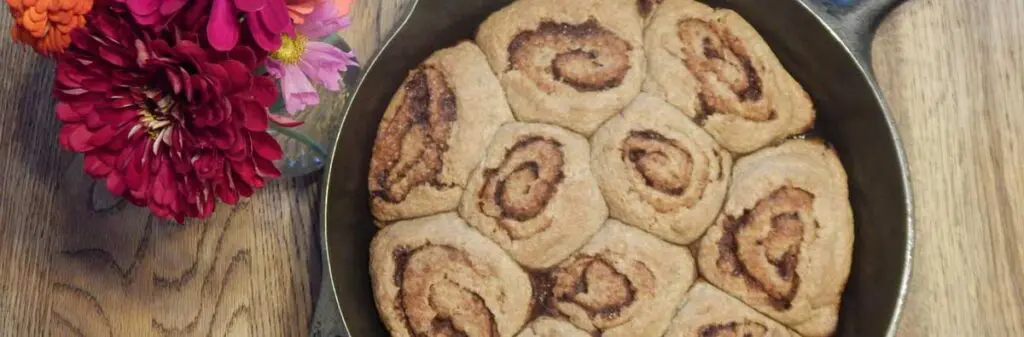 Sourdough cinnamon buns in a skillet.