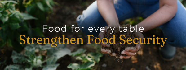 Person holding soil in a garden with "Enhanced Food Security.