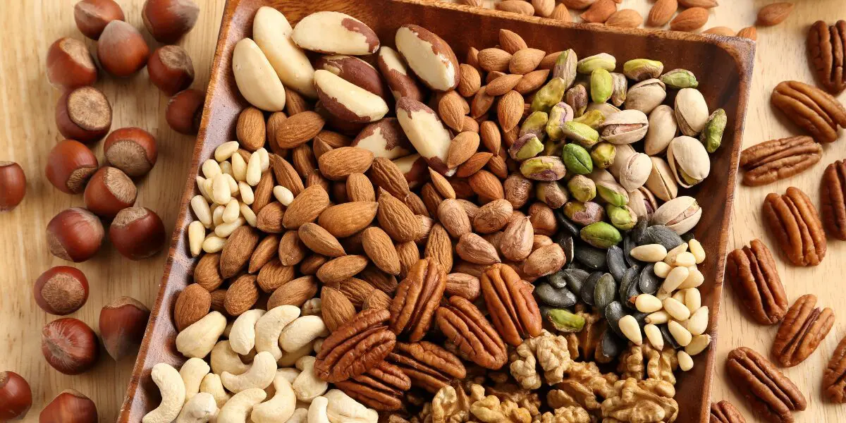 A wooden tray filled with assorted nuts, a wholesome staple of the American diet.