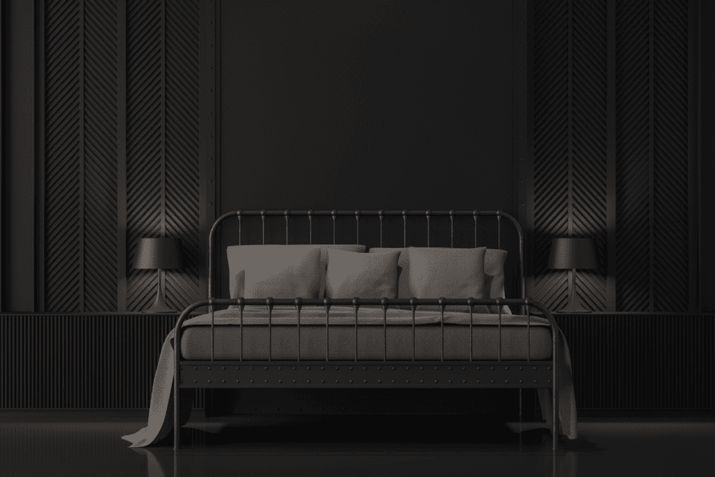 A modern black metal bed with gray bedding offers comfort in a warming world.
