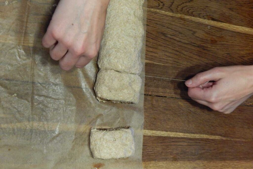 Cutting the cinnamon log into sections.