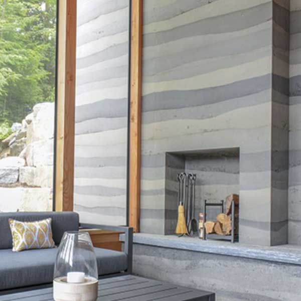 Interior plaster wall of fireplace and insert.