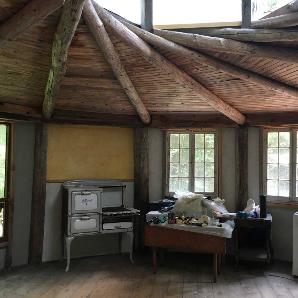 Interior of a simple round wooden framed round home.