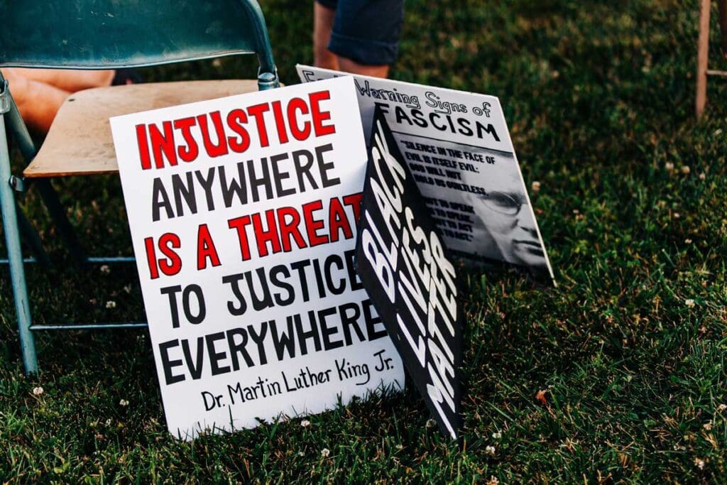 Activism sign featuring Black Lices Matter and Injustice Anywhere Is. A Threat To Justice Everywhere, from Dr. Martin Luther King Jr.