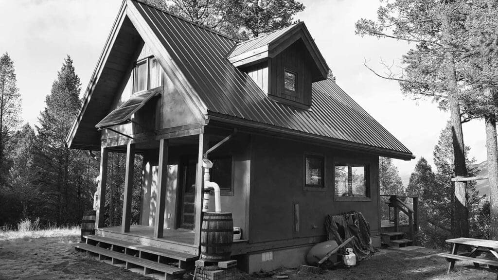 Downspout filter on an off-grid cabin.]