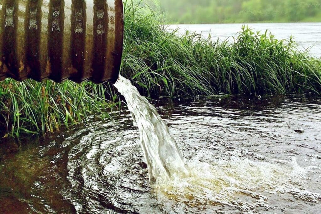 Water flowing from a storm drain into the lake.