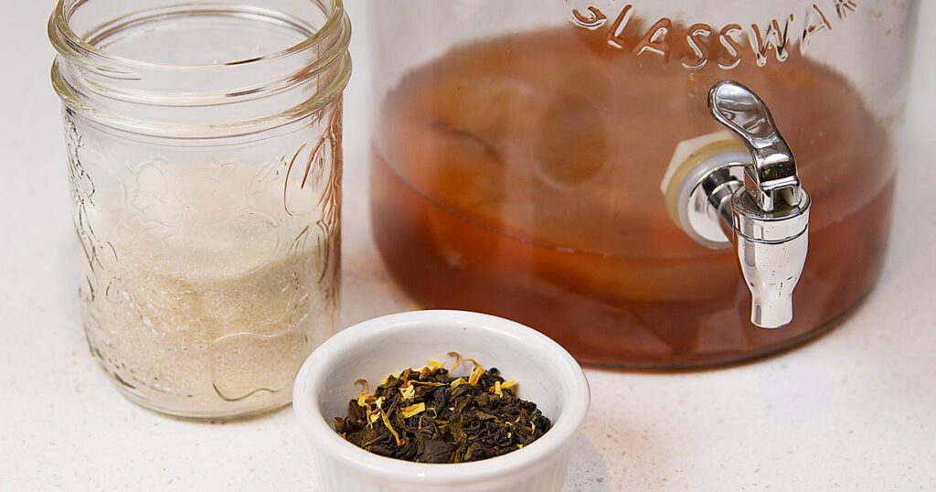 Juice pitcher, a bowl of spices and sugar in a jar.