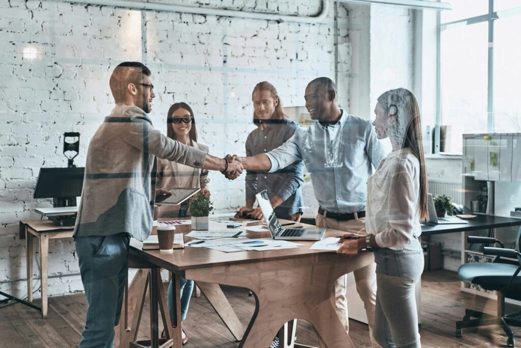 A group of colleagues shaking hands