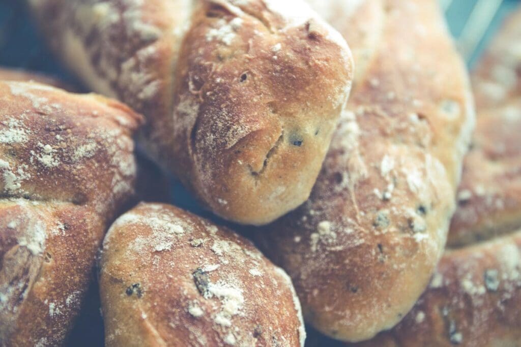 Freshly baked scones (pastries) with powdered sugar. 