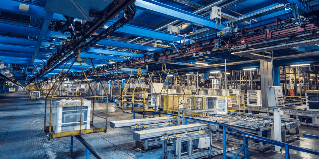 A modern factory interior with conveyor belts and machinery.