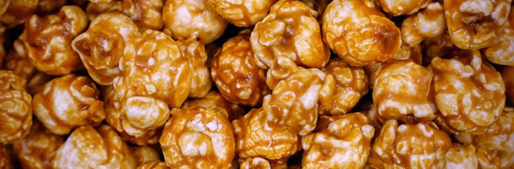 Close-up of caramel-covered popcorn, a delightful treat perfect for any Christmas gathering.